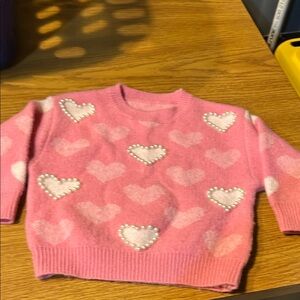 Size 2 T Pink and White Sweater with Heart Designs.